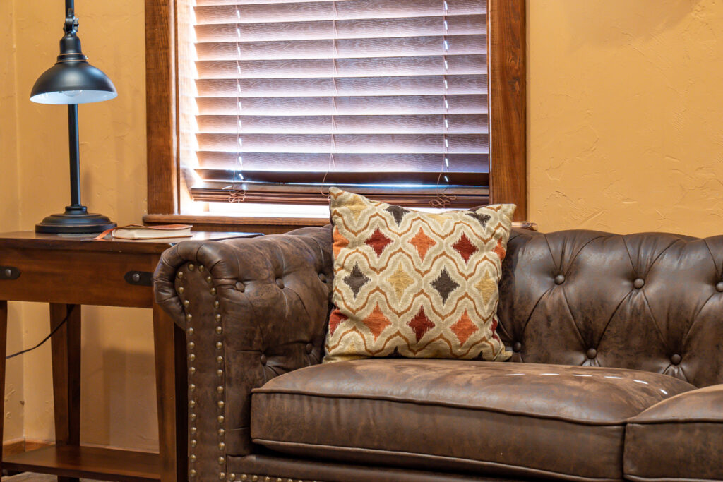 groom's suite brown couch lounge area