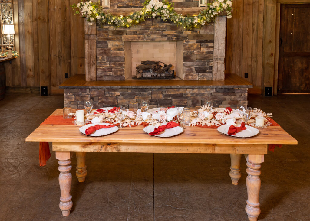 wood table and red accents table setting