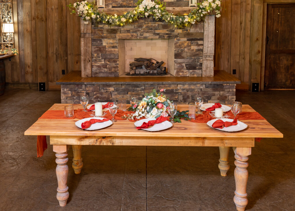 wood table and red accents table setting