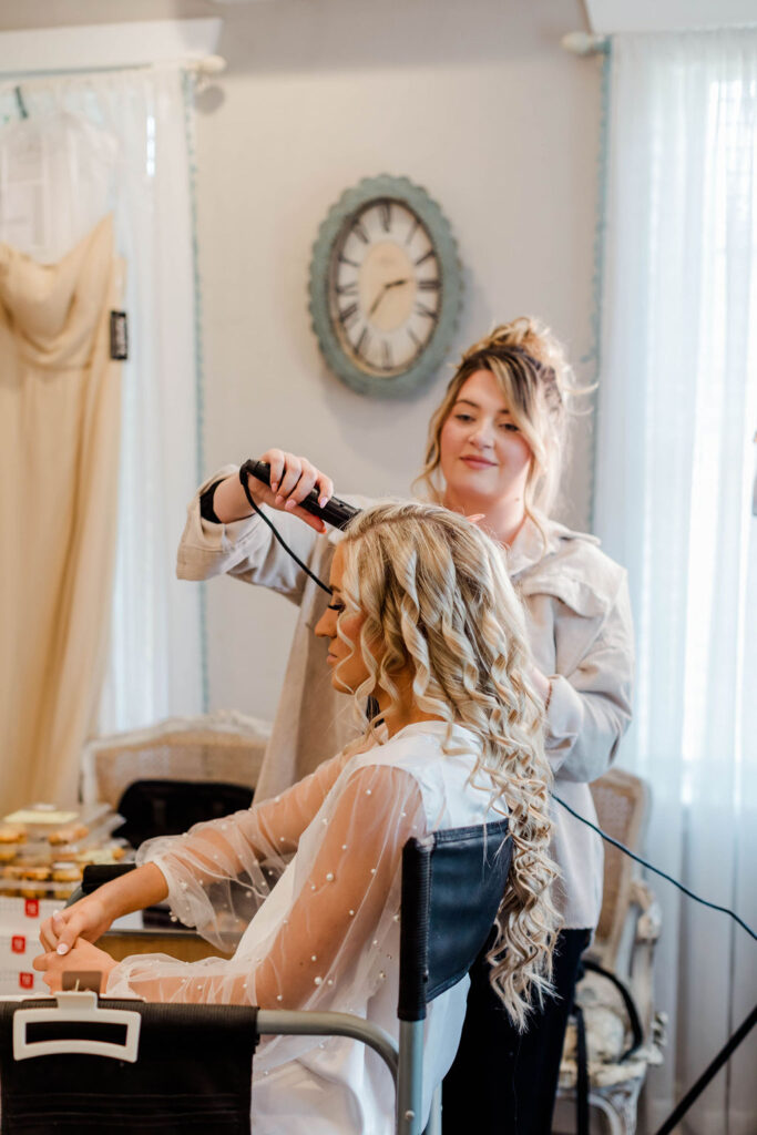 042A5870 hair stylist curling bride's hair