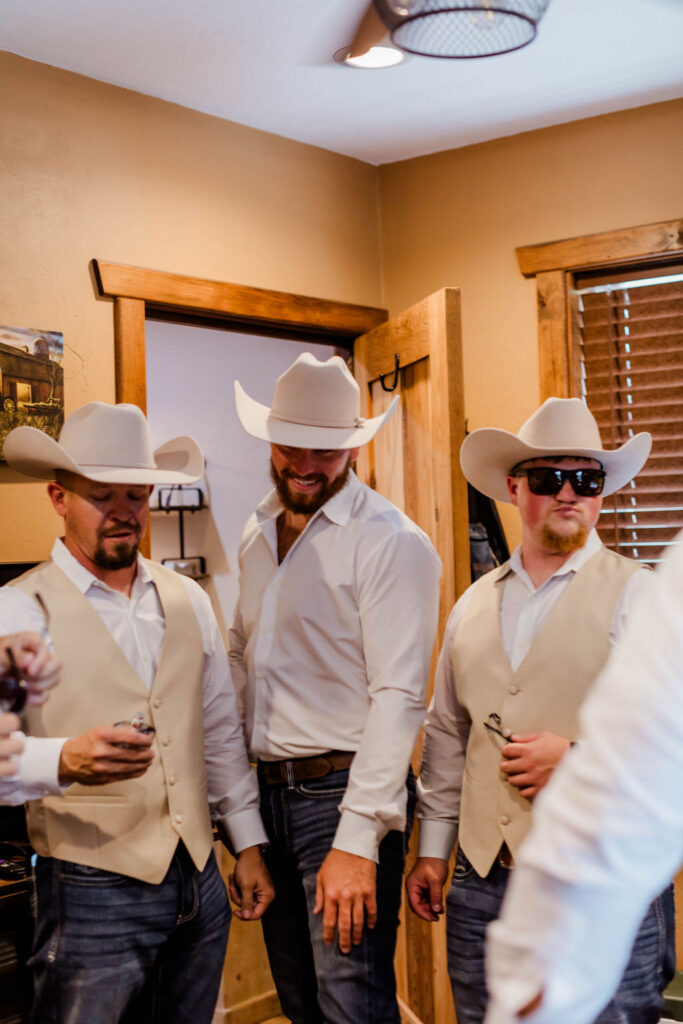 groom and groomsmen in suite before wedding