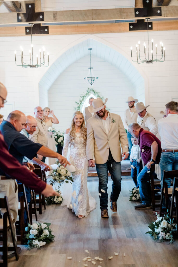 bride and groom walking down aisle