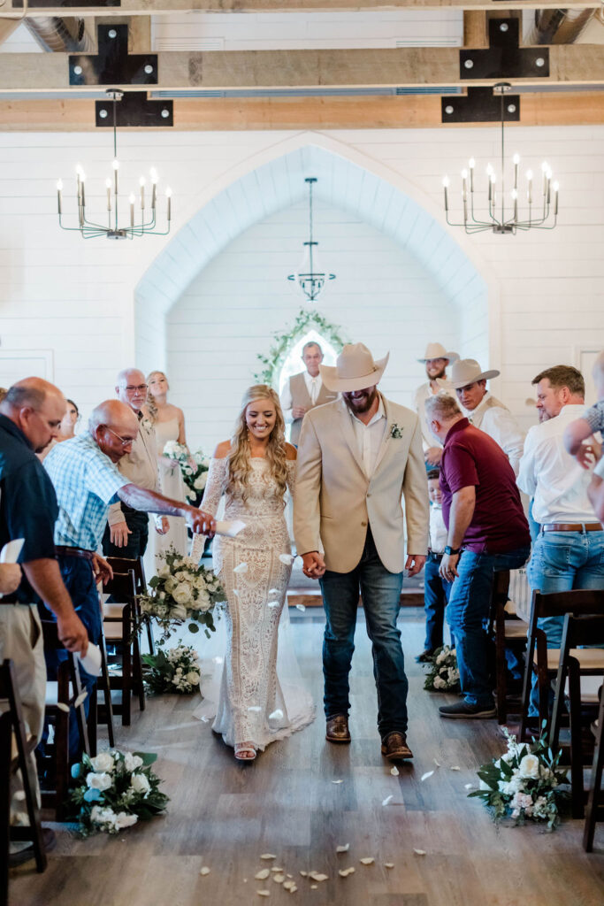 bride and groom walking down aisle