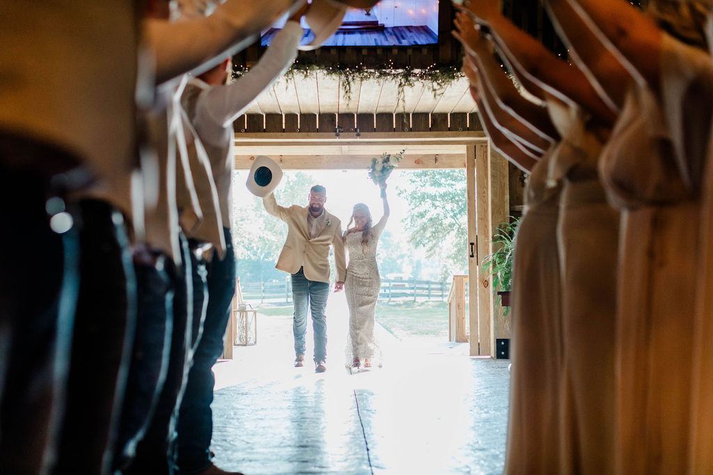 bride and groom entering wedding reception