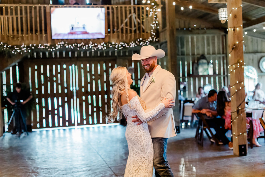bride and groom laughing during first dance