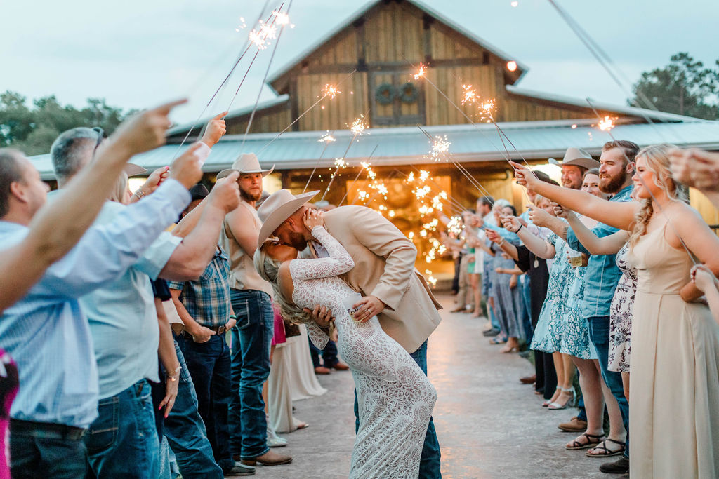 couple kissing during sparkler exit