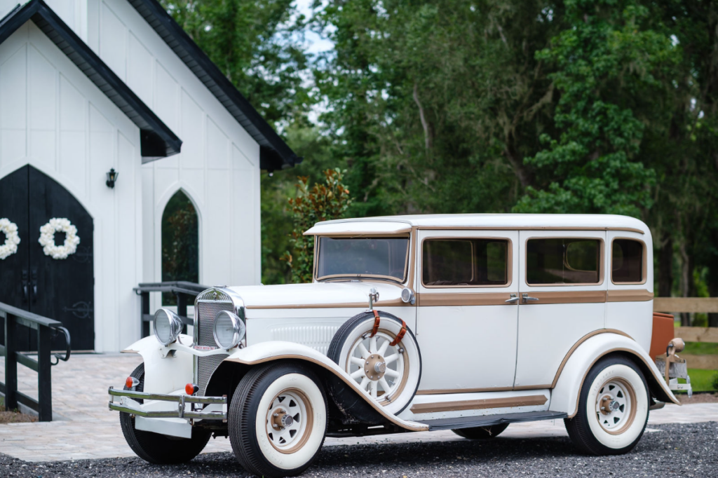 antique car outside wedding chapel